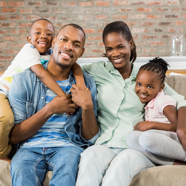 happy family sitting on a couch