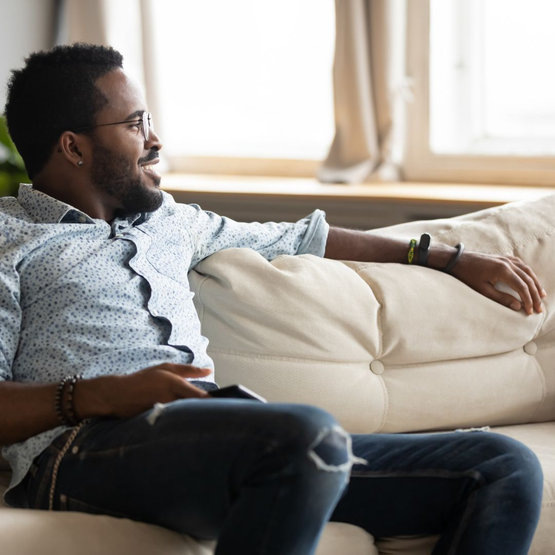 man on couch looking comfortable