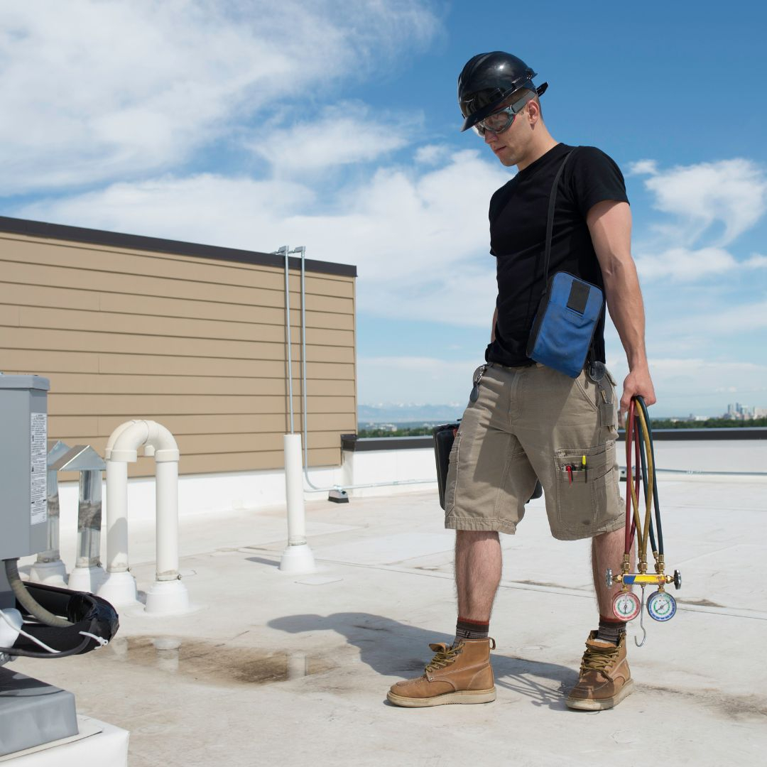HVAC tech on roof