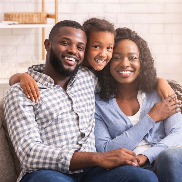 happy family sitting on couch