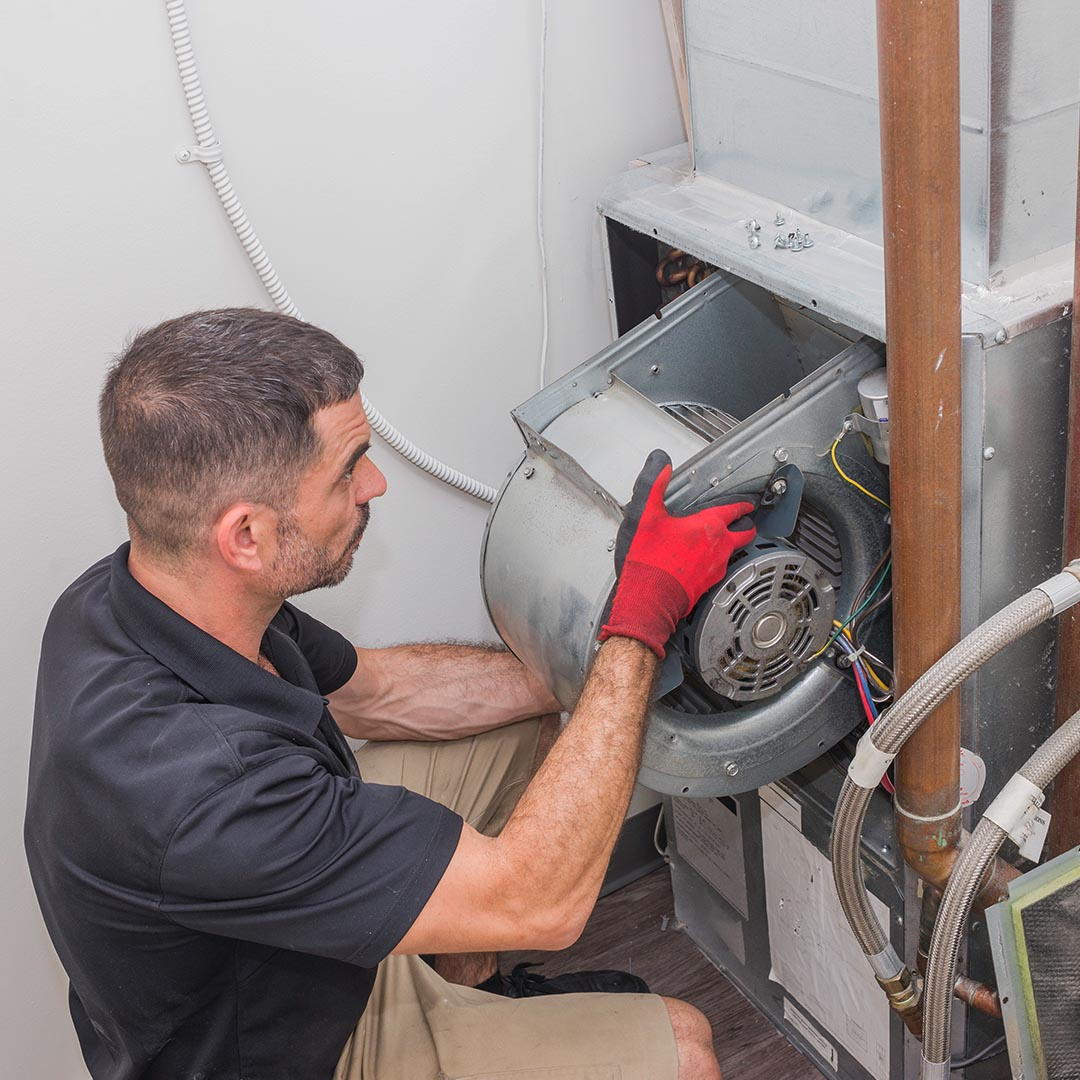 hvac tech working on an commercial ac unit hvac tech working on an commercial ac unit
