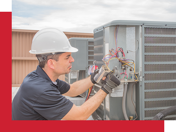 hvac technician working on ah hvac unit