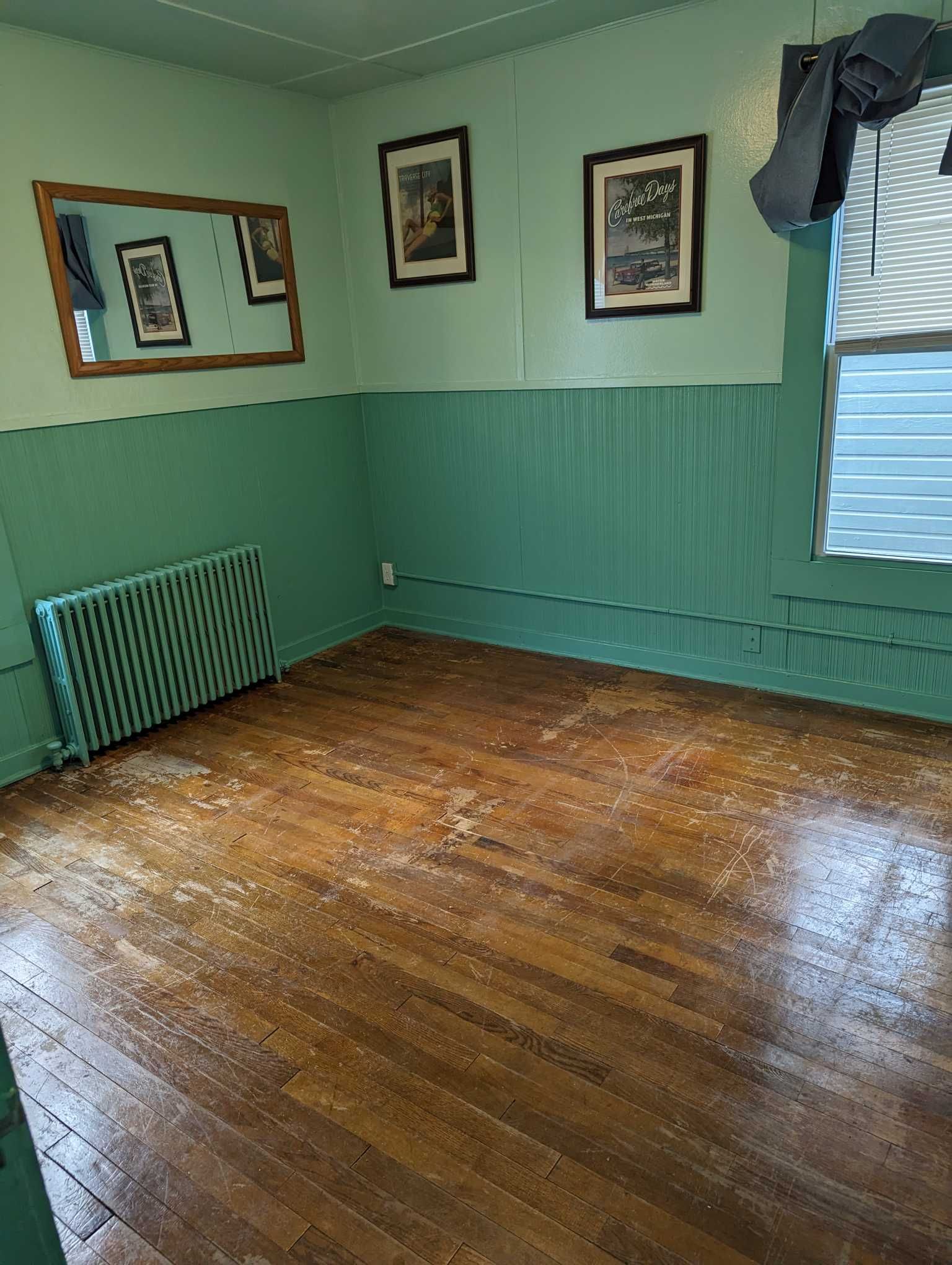 a before photo of old flooring in cabin eleven