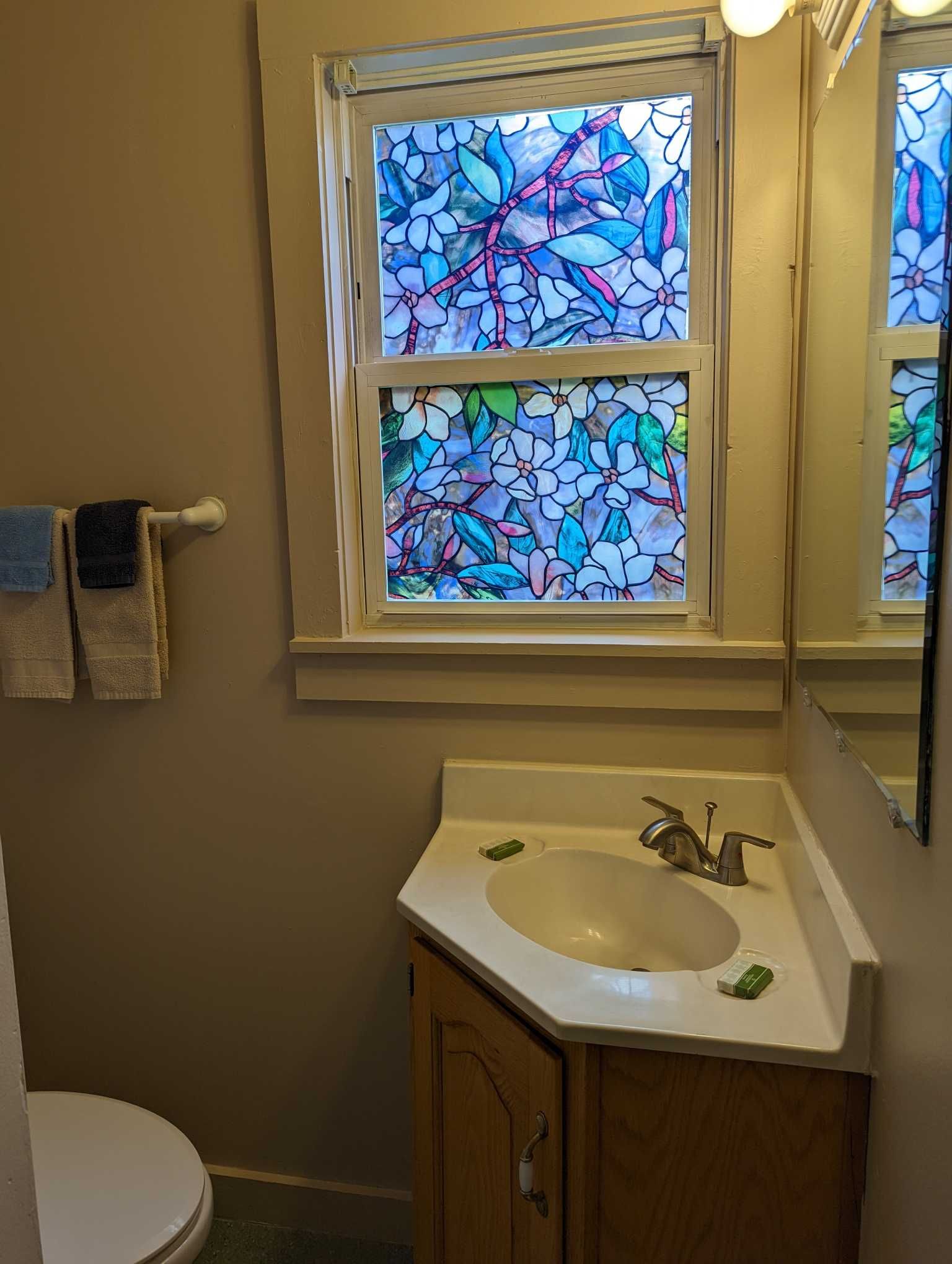 a bathroom with a corner sink