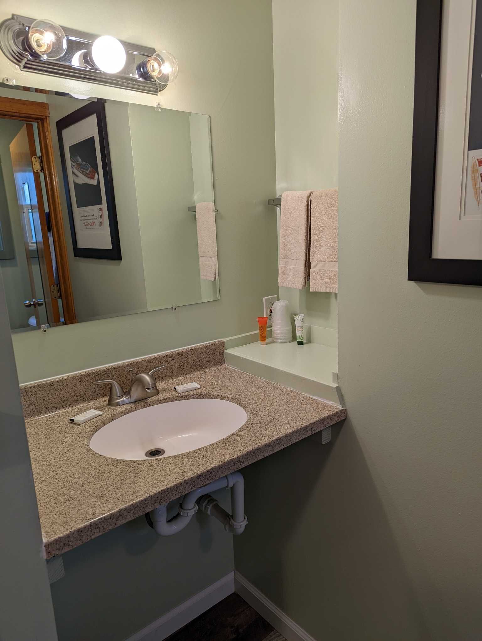 a single sink vanity and mirror in a bathroom