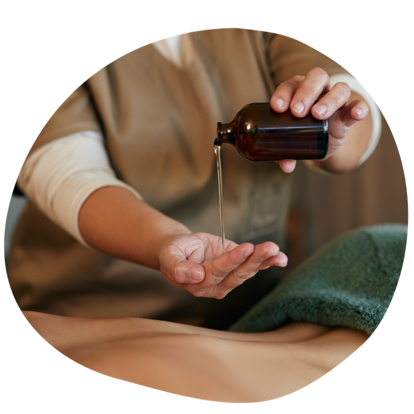 Pouring warm oil out for a massage