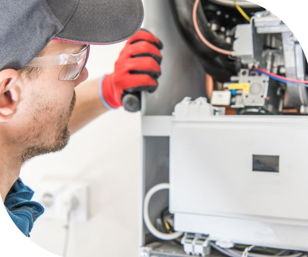 technician inspecting water heater