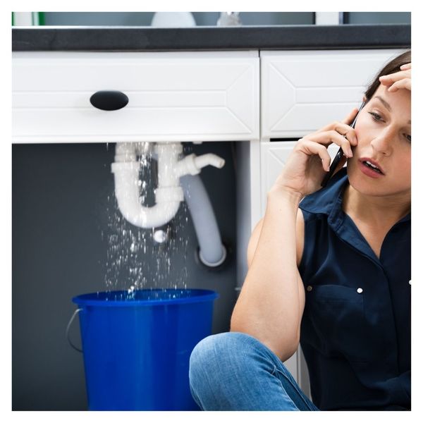 on the phone with plumber