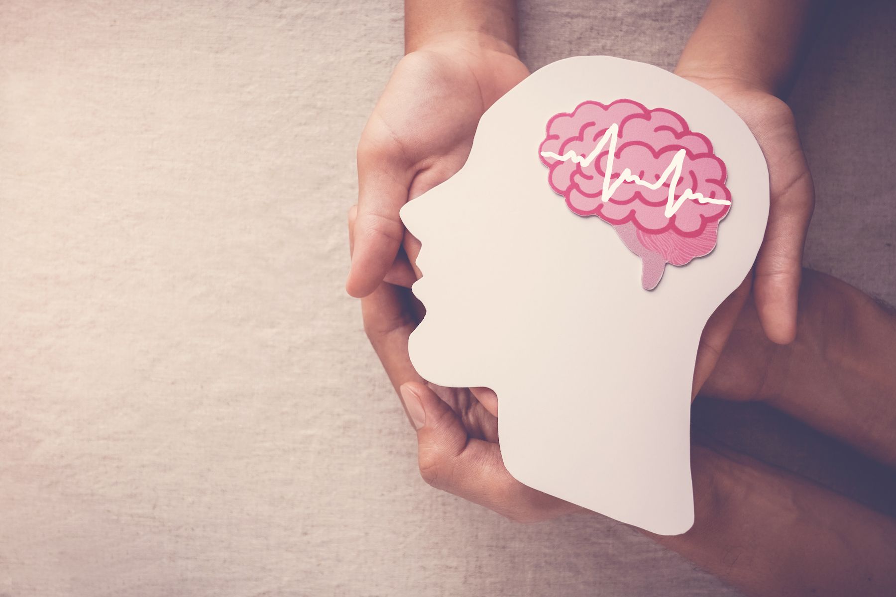 adult-child-hands-holding-encephalography-brain-paper-cutout-epilepsy-alzheimer-awareness-seizure-disorder-mental-health-concept.jpg