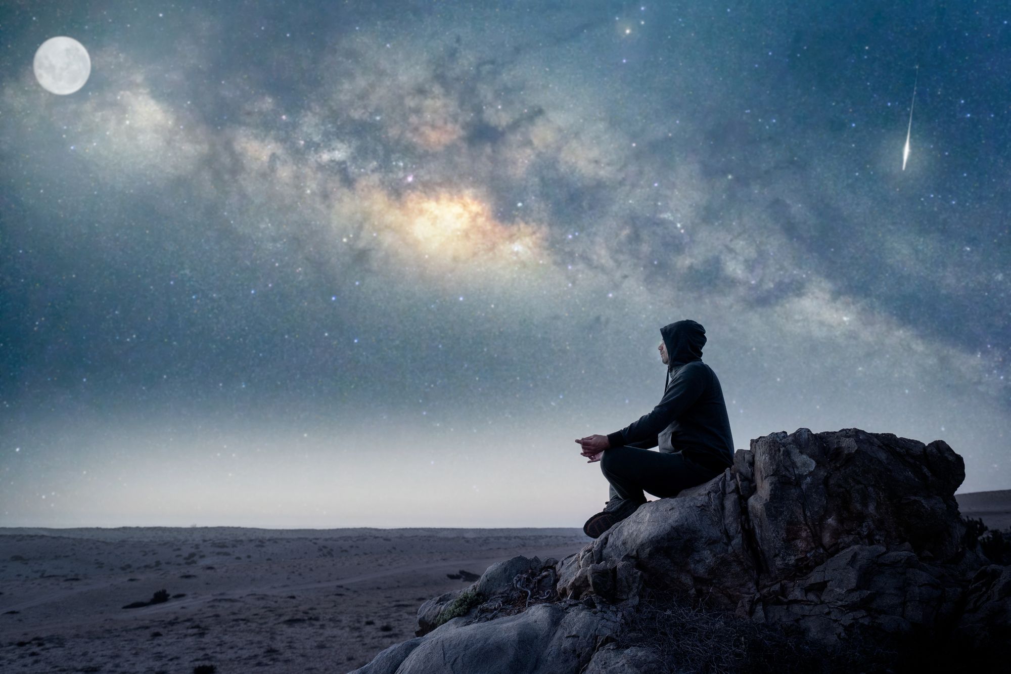 person-sitting-top-mountain-meditating-with-milky-way-moon-background.jpg