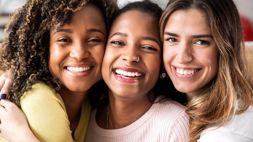 three-beautiful-smiling-girl-friends-hugging-toget-2022-12-17-03-39-04-utc.jpg