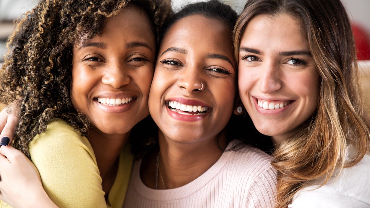 three-beautiful-smiling-girl-friends-hugging-toget-2022-12-17-03-39-04-utc.jpg