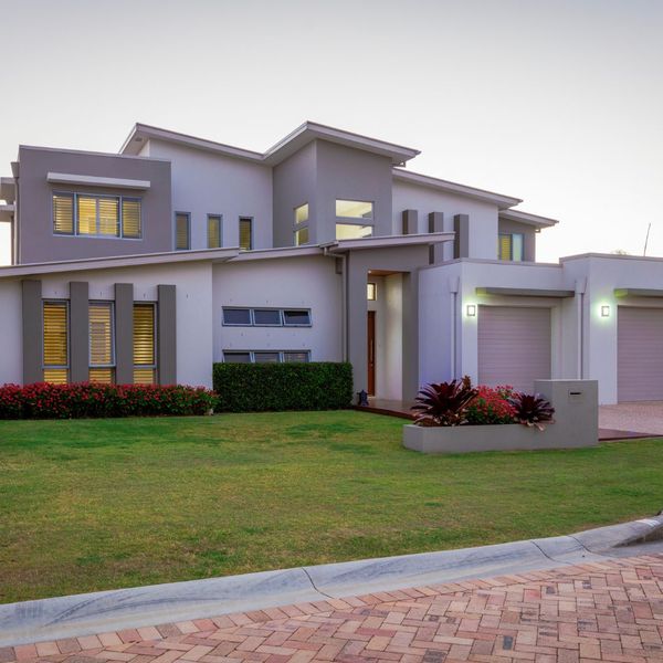 A modern home with grays and whites as exterior paint colors