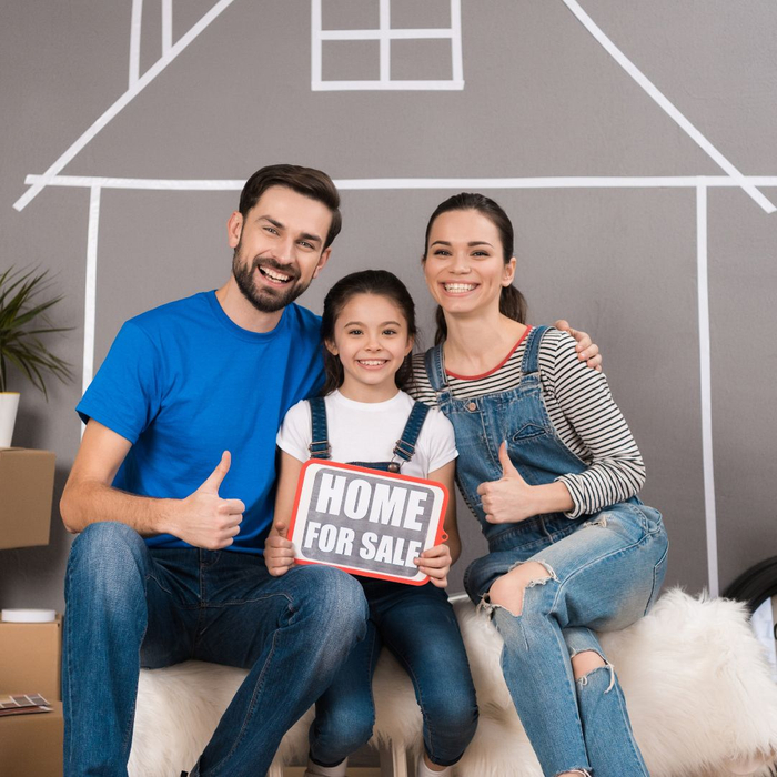family holding a home for sale sign family holding a home for sale sign