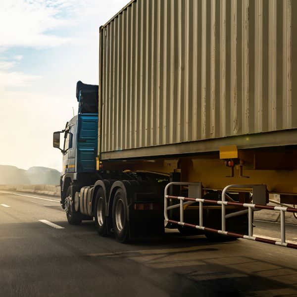shipping truck driving on road