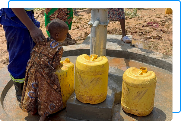 Kids getting gallon buckets of water