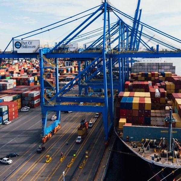 loading cargo containers on dock