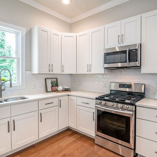 a kitchen full of white cabinets Understanding Cabinet Design (4).jpg