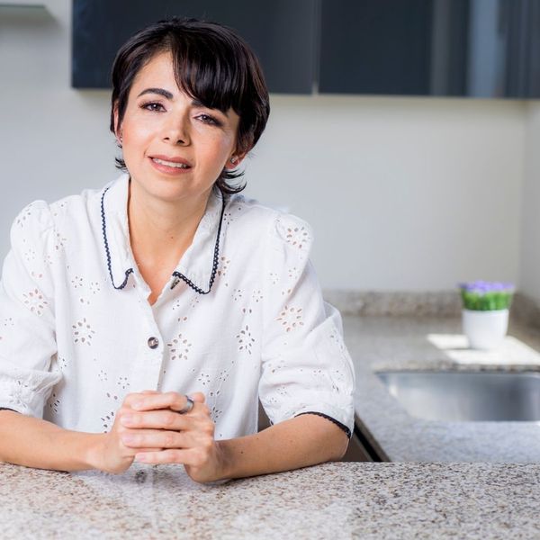 woman leaning on counter