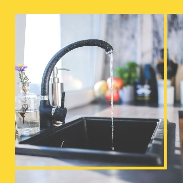 a kitchen sink with running water Showroom Specific (2).jpg