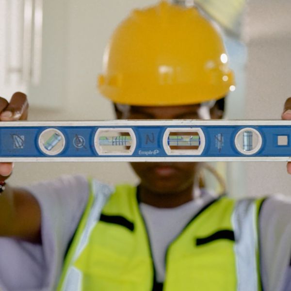 contractor holding measuring tape