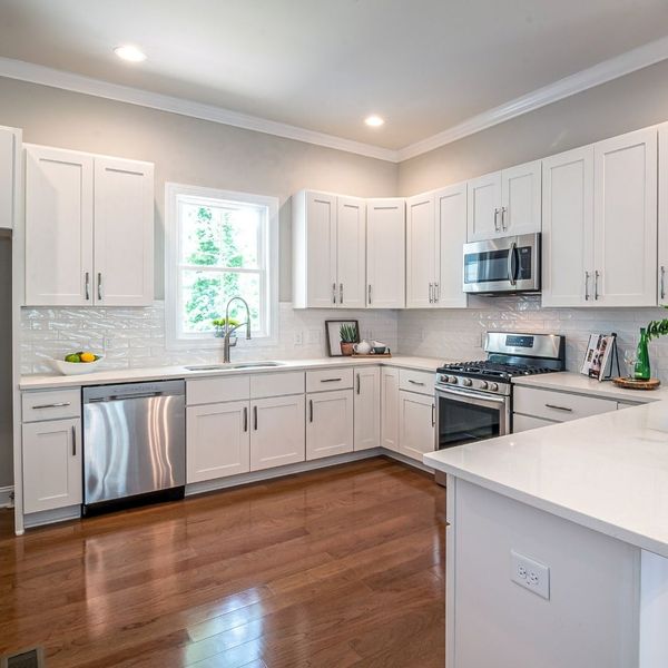 newly remodeled kitchen with white cabinets