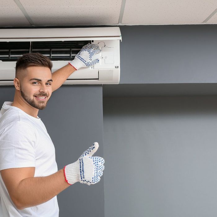 man working on AC system