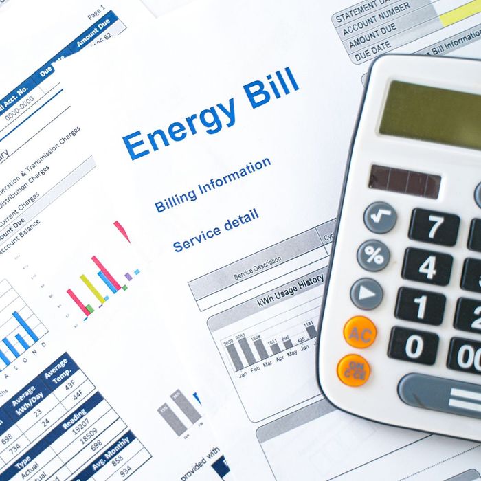 a copy of an energy bill and a calculator