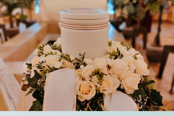 Urn surrounded by a white rose floral arrangement Del Mar1.jpg