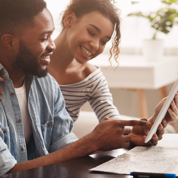 Couple looking at trip plans 