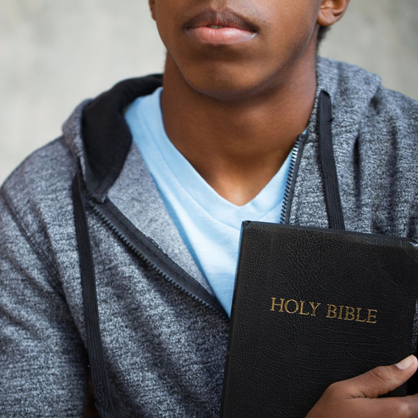 young man holding the bible