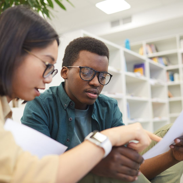 2 students discussing a paper