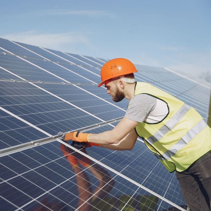 contractor installing solar panels. 