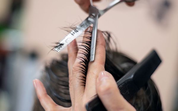 Image of a client getting his hair done