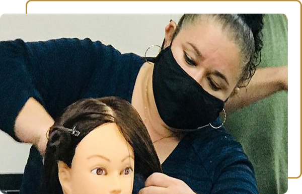 Cosmetology student practicing on a mannequin