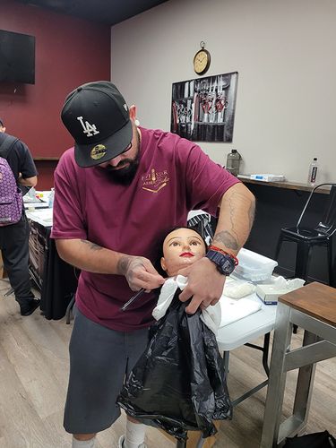 Image of a student working on a dummy