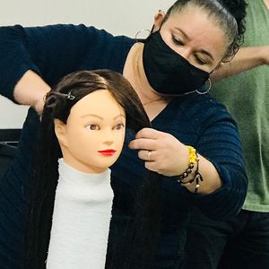 Student Practicing on Mannequin