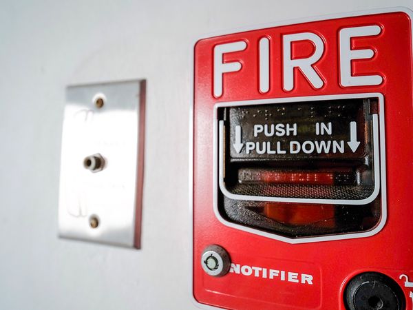 Fire alarm alert button in a building.