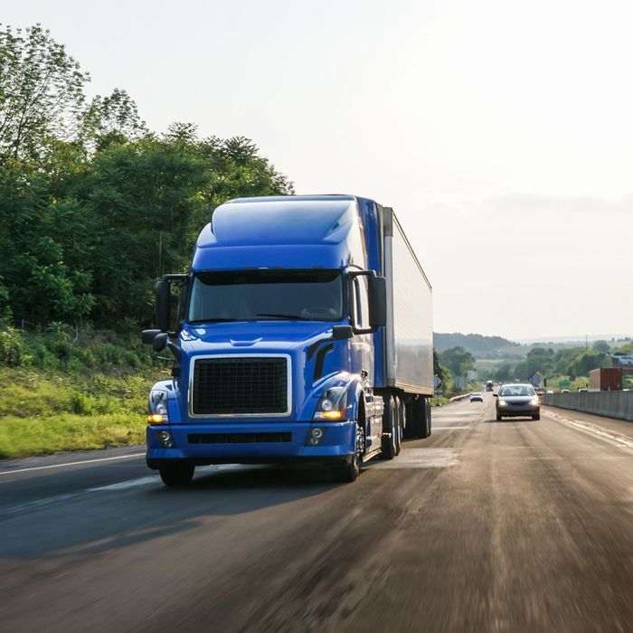 blue truck on the road