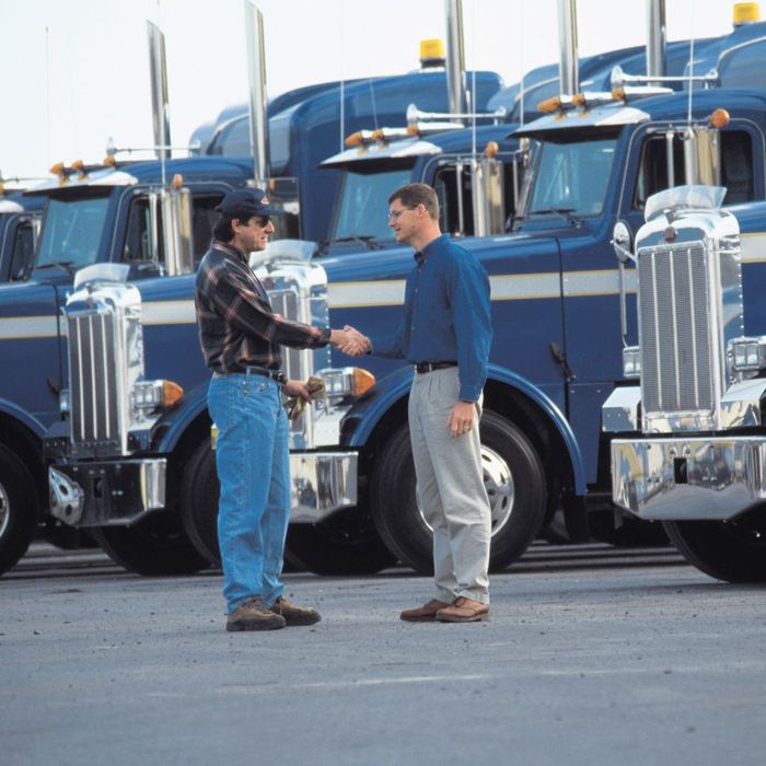Man shaking hands with commercial driver