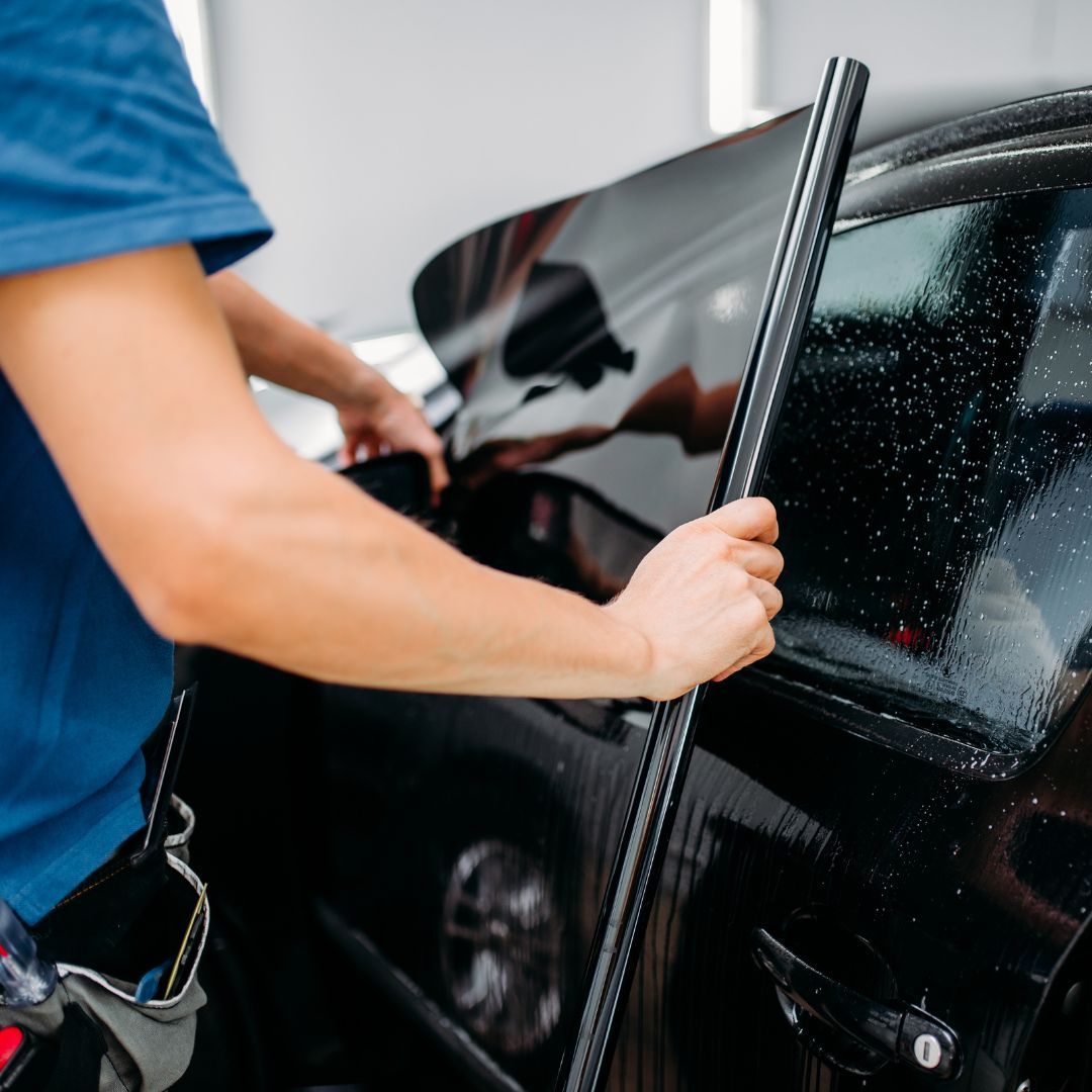 pan applying a window tint