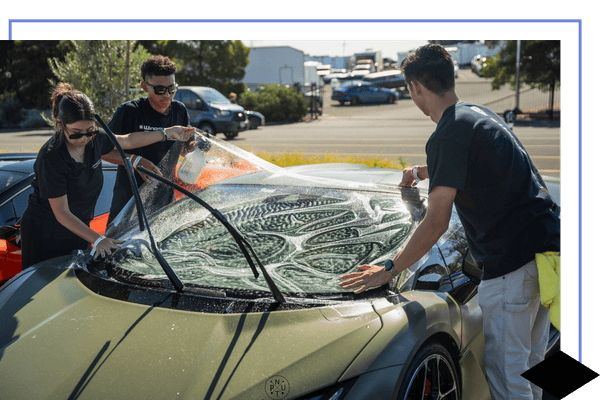 techs preparing a car for it's windshield skin