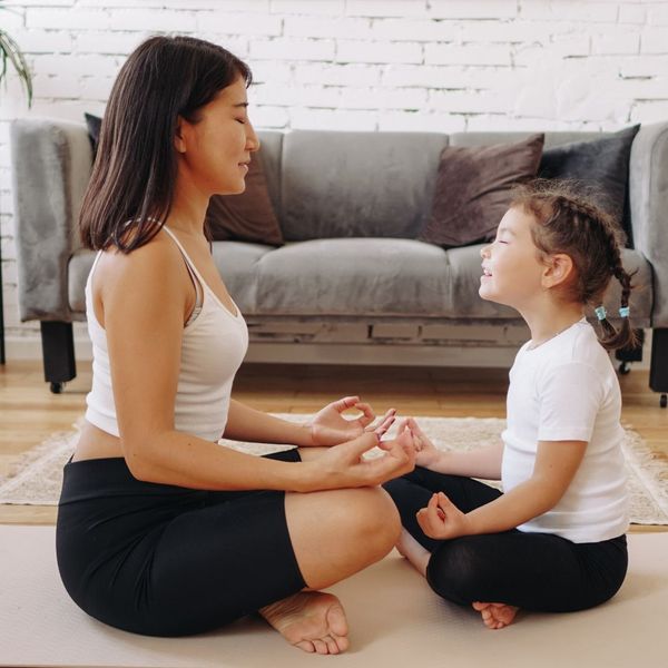 mother and daughter meditating together