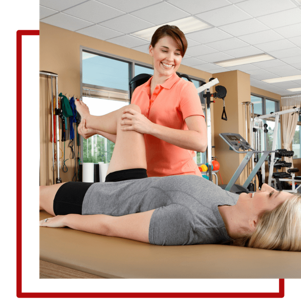 female physical therapist working with patient