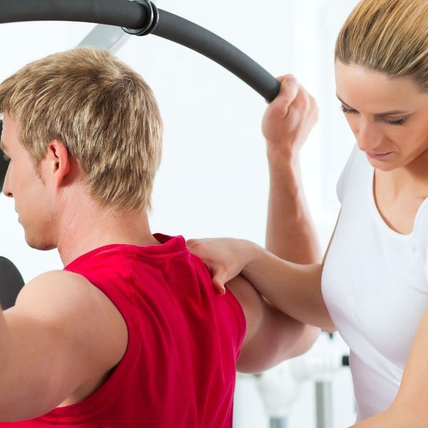 athlete working with a physical therapist