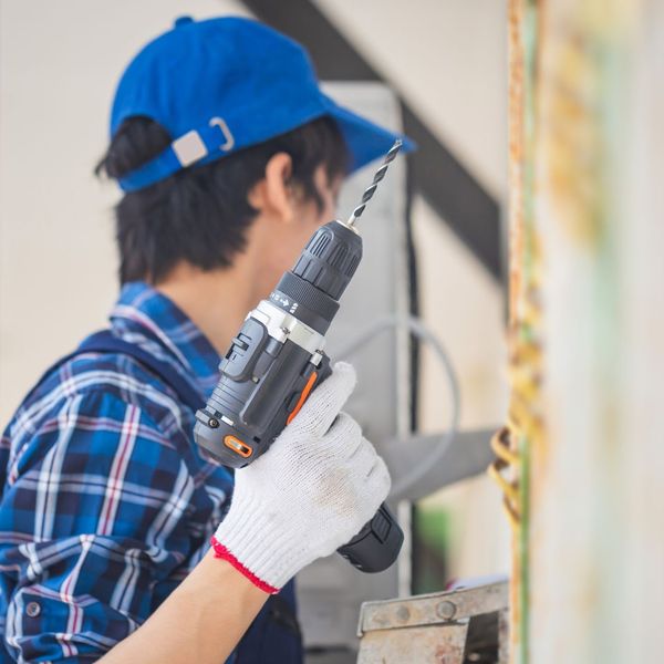 HVAC worker repairing a system