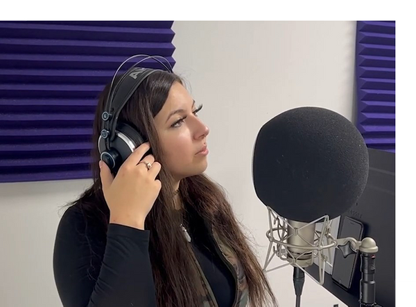 woman recording soundtrack in studio