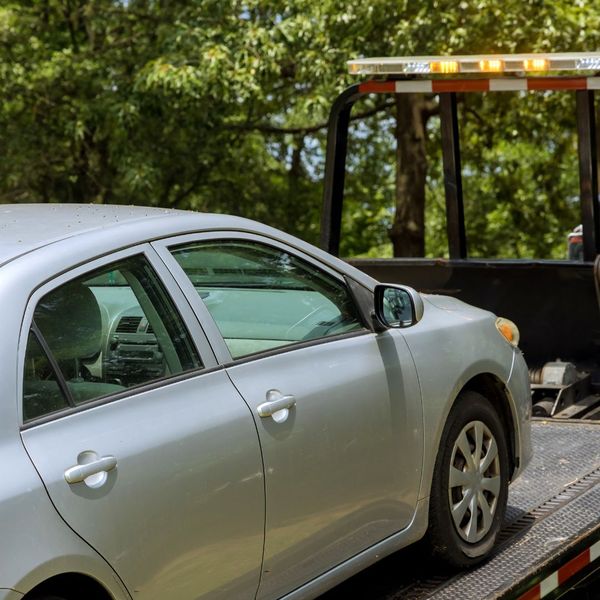 car on tow truck bed