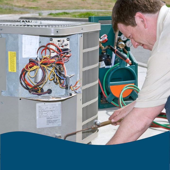 Man working on AC Unit