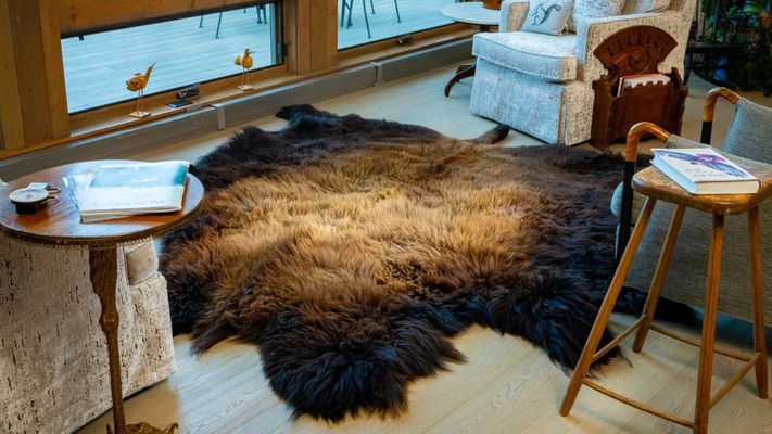 A high-quality bison hide in a living room. A high-quality bison hide in a living room.